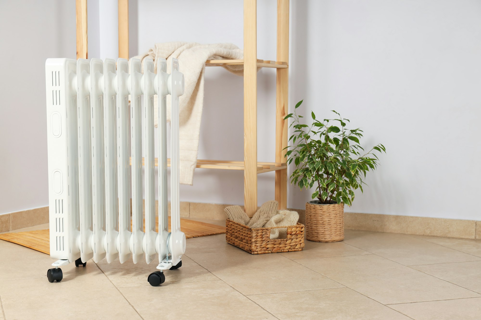 Concept of heating season, modern electric heater in room